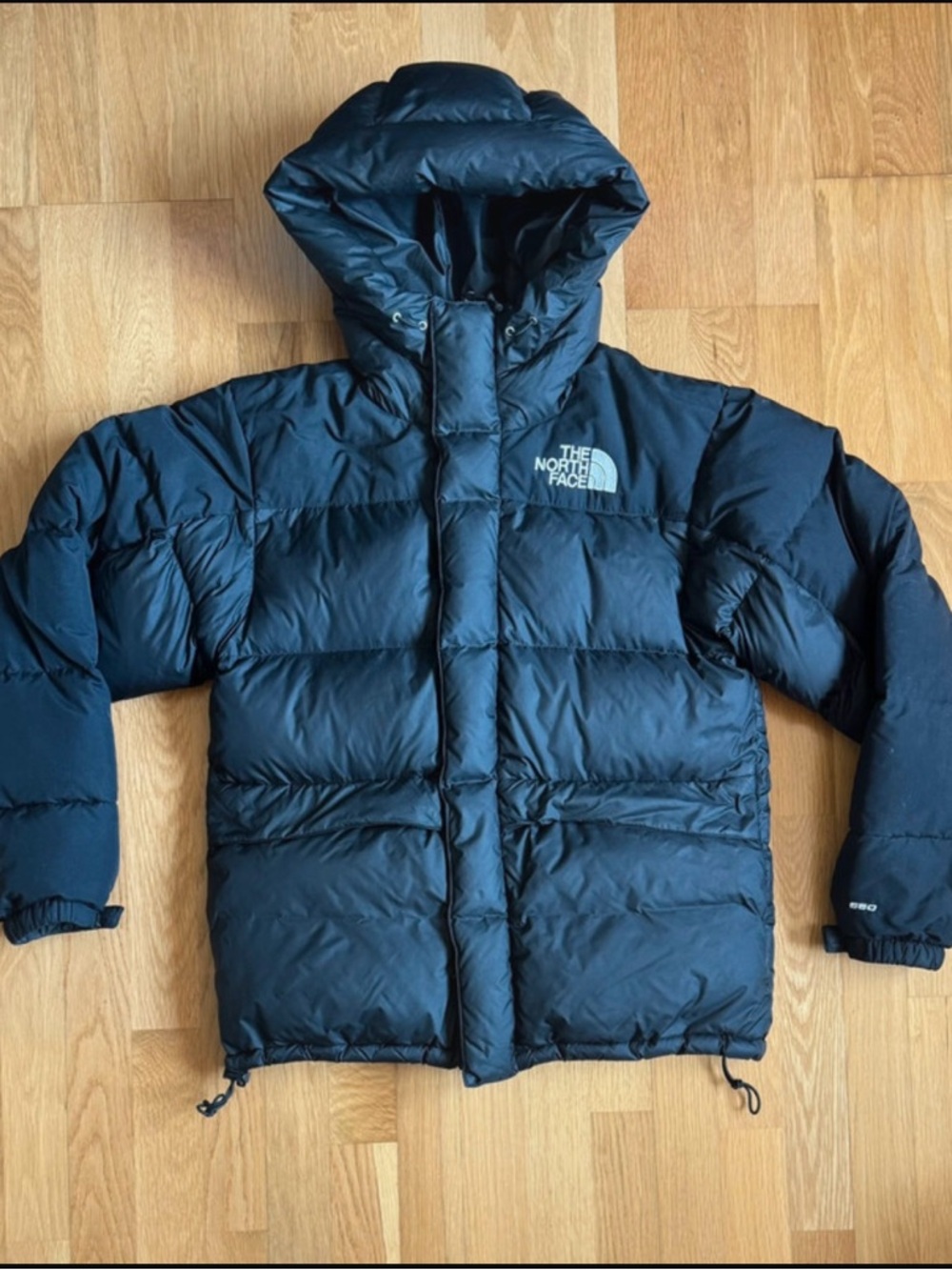 The North Face  Dark Black Puffer Hooded Jacket in good company